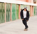 Young skater rolling down the street Royalty Free Stock Photo