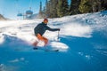 Young skier braking with a smile on his face