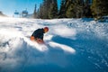 Young skier braking with a smile on his face