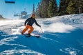 Young skier braking with a smile on his face