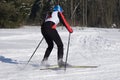 A young skier finishes the marathon in the Park and returns home .