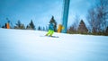 Young skier going quickly down the slope