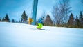 Young skier going quickly down the slope Royalty Free Stock Photo