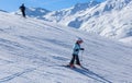 Young skier and her father. Ski resort Val Thorens