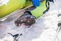 young skier rests on a snowy slope on a sunny day. school holidays.