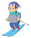 Young skier wearing waving scarf having fun gliding on snow