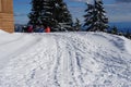 Four young skiers are enjoying a rest and the view