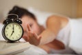 Young sleeping woman in bedroom.