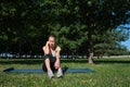 Young slender girl doing yoga on a sunny morning, sad mood, sad thoughts Royalty Free Stock Photo
