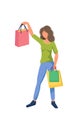 Young slender girl in sporty casual clothing holds sales bags isolated on a white background