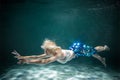 Young Slender Girl Underwater with a Cloth. Water Magic. Copy Space Royalty Free Stock Photo