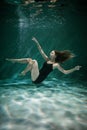 Young Slender Girl Underwater with a Cloth. Water Magic. Underwater Photography. Art Royalty Free Stock Photo