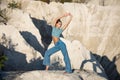 Slender woman doing yoga exercises in the white mountains. The girl travels in nature. Relax yoga at the top of the mountain Royalty Free Stock Photo