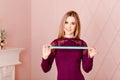 Young slender woman nutritionist holds a centimeter tape, diet Royalty Free Stock Photo