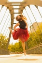 Young slim woman with long brown hair dancing