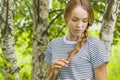 Young slim girl in a birch grove. Royalty Free Stock Photo