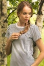 Young slim girl in a birch grove. Royalty Free Stock Photo