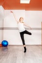 Young slim girl dancing in the gym. The concept of sport, dance Royalty Free Stock Photo