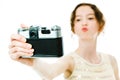 Young slim girl taking selfie with vintage analog camera - kiss