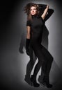 Young slim glamour lady dressed in black Royalty Free Stock Photo