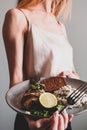 Woman is eating her lunch of fresh baked fish Royalty Free Stock Photo