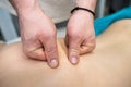 young slim woman having relaxing massage on back in spa Royalty Free Stock Photo