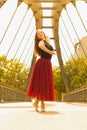 Young slim woman with long brown hair dancing