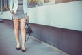 Young slim woman walking by the street wearing high heels Royalty Free Stock Photo