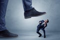 Trampled small businessman in suit Royalty Free Stock Photo