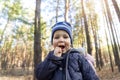 Young small cute adorable cheerful playful caucasian toddler boy enjoy having fun walking at spring or autumn forest and Royalty Free Stock Photo