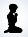 Little boy is praying. Vector drawing