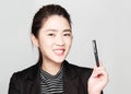 Young smart beautiful asian business woman wore black suit and glasses,smart and thinking holding Document, talking phone Royalty Free Stock Photo