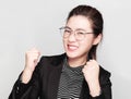 Young smart beautiful asian business woman wore black suit and glasses,smart and thinking holding Document, talking phone Royalty Free Stock Photo