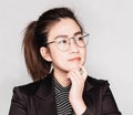 Young smart beautiful asian business woman wore black suit and glasses,smart and thinking holding Document, talking phone Royalty Free Stock Photo