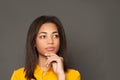 Young smart black woman thinking, close up portrait Royalty Free Stock Photo