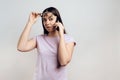 Young smart girl politely communicates on cell phone. Royalty Free Stock Photo