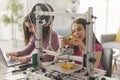 Young girls learning 3D printing at home