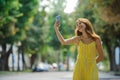 Young smart smiling girl taking a selfie with her cell phone Royalty Free Stock Photo