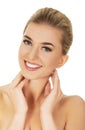 Young smile woman touching her neck. Royalty Free Stock Photo