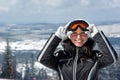 Young smiley woman skier