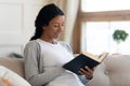 Young smiling african american girl read book Royalty Free Stock Photo