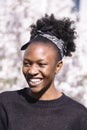 Young smiling african girl in spring blossom park Royalty Free Stock Photo