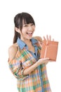 Young smiling asian woman with a gift.