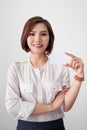 Young smiling asian woman holding a blank card, gesture isolated Royalty Free Stock Photo