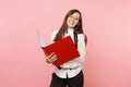 Young smiling attractive successful business woman in glasses holding red folder for papers document on pink Royalty Free Stock Photo