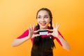 Young smiling beautiful Asian woman presenting credit card in hand showing trust and confidence for making payment Royalty Free Stock Photo