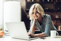 Young Smiling Beautiful Woman Using Laptop at Home Royalty Free Stock Photo