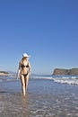 Young smiling blond woman in black bikini Royalty Free Stock Photo