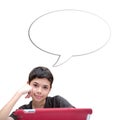 Young smiling boy with one hand resting on cheek with speech bubble against blue background