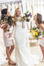 Young smiling bride and bridesmaids with bouquets in wedding Royalty Free Stock Photo